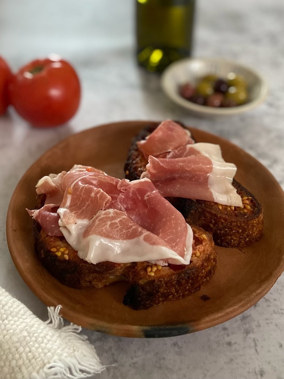 Grilled Bread with Tomato Tapenade and Prosciutto