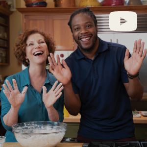 Joanne Weir cooking with a friend with messy hands